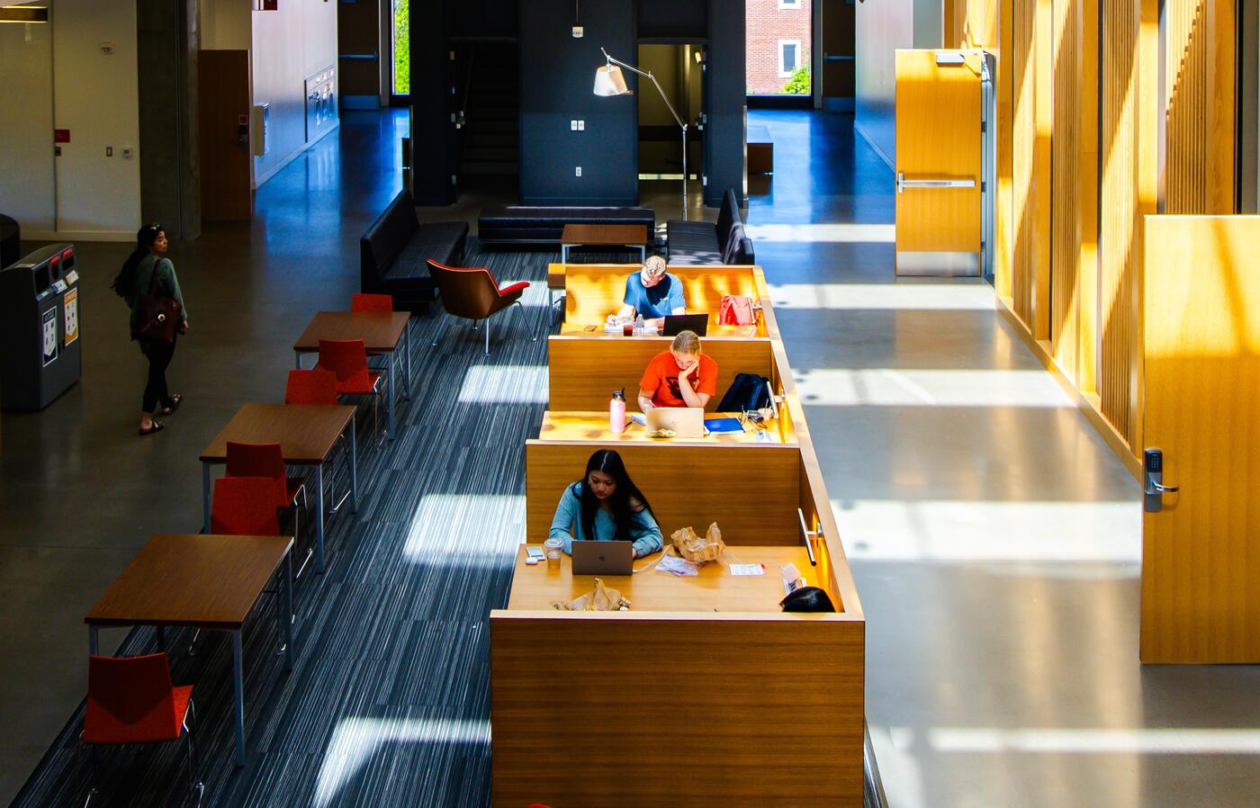 Photo taken from inside a building at OSU. The downward angle shows students studying at desks.